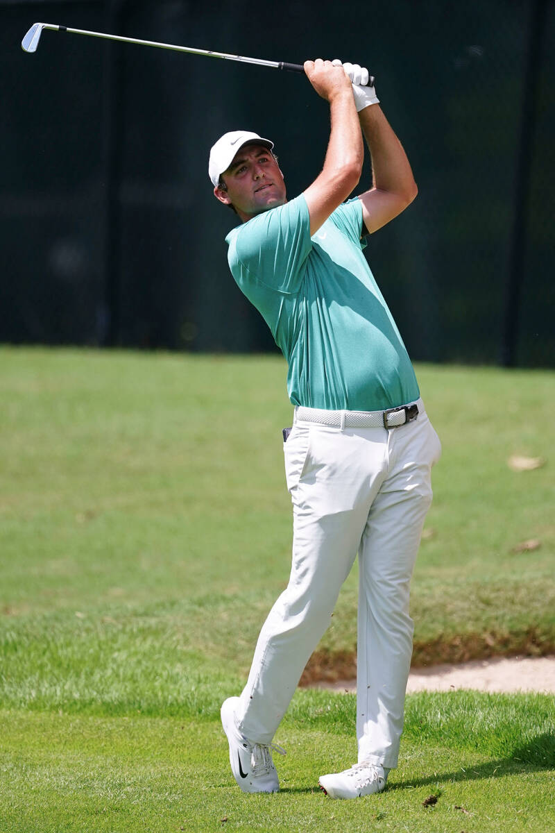 Scottie Scheffler hits from the first fairway during the final round of the Tour Championship g ...
