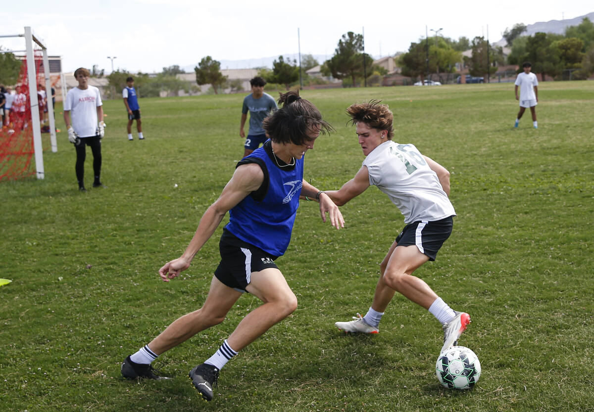 Palo Verde’s Quentin Gomez, battles for the ball against Matthew Vogel during soccer pra ...