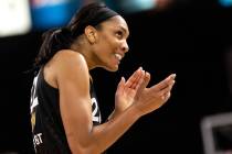 Las Vegas Aces forward A'ja Wilson (22) claps to the crowd after a referee called a foul on the ...