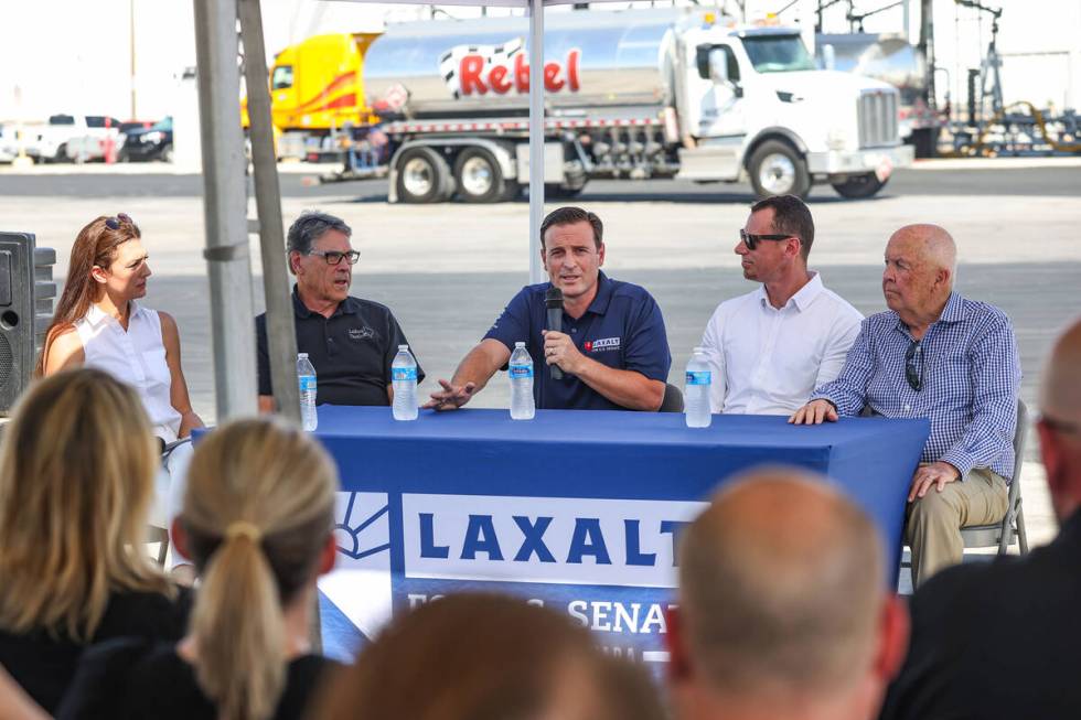 U.S. Senate candidate Adam Laxalt, center, speaks at a panel discussing energy policy outside R ...