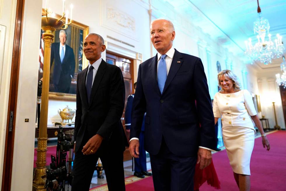 U.S. President Joe Biden, with first lady Jill Biden, and former President Barack Obama, with f ...