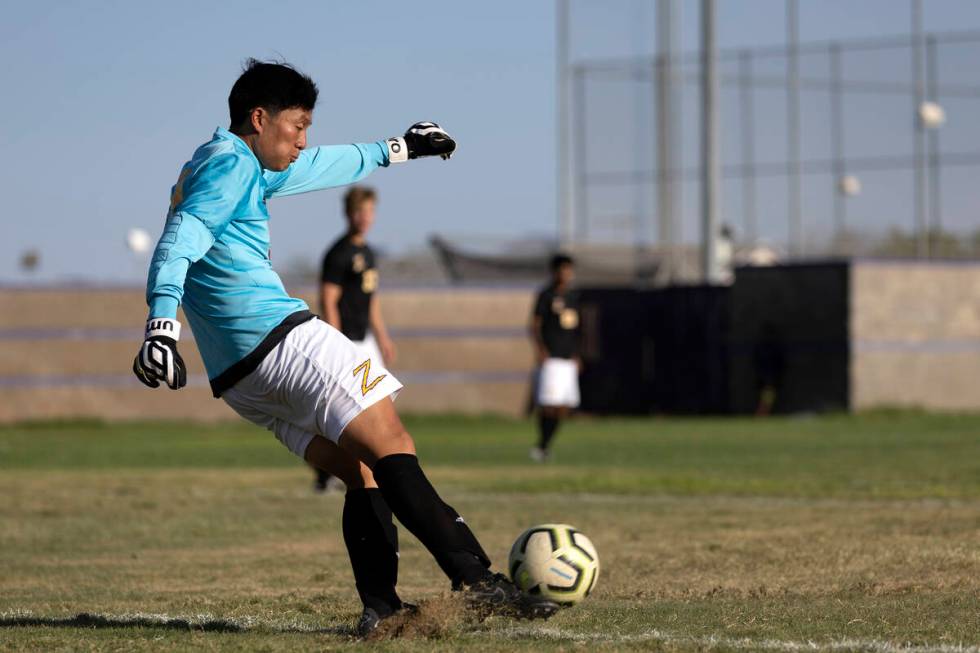 Durango goaltender Joshua Wong kicks the ball into play during a high school soccer game agains ...