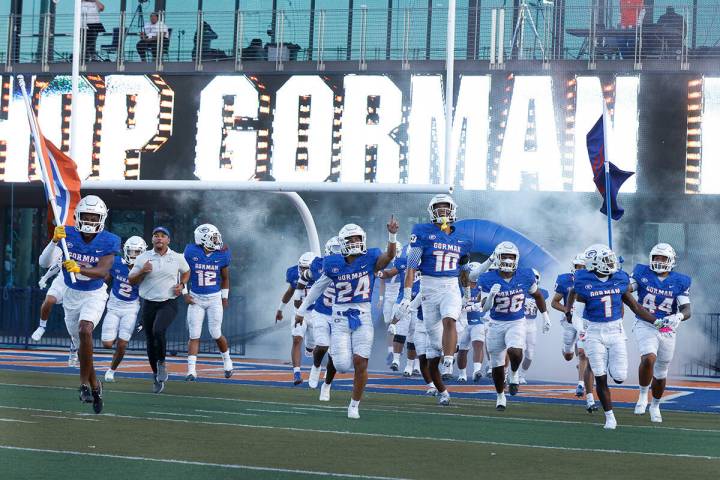 Bishop Gorman players take the field to face Mater Dei High at Bishop Gorman High School on Fri ...