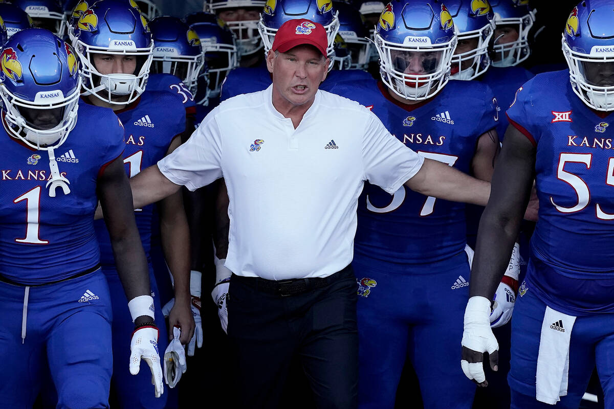 Kansas head coach Lance Leipold leads his team onto the field before an NCAA college football g ...