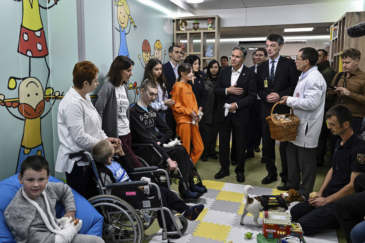US Secretary of State Antony Blinken meets children during a visit to a children hospital in Ky ...