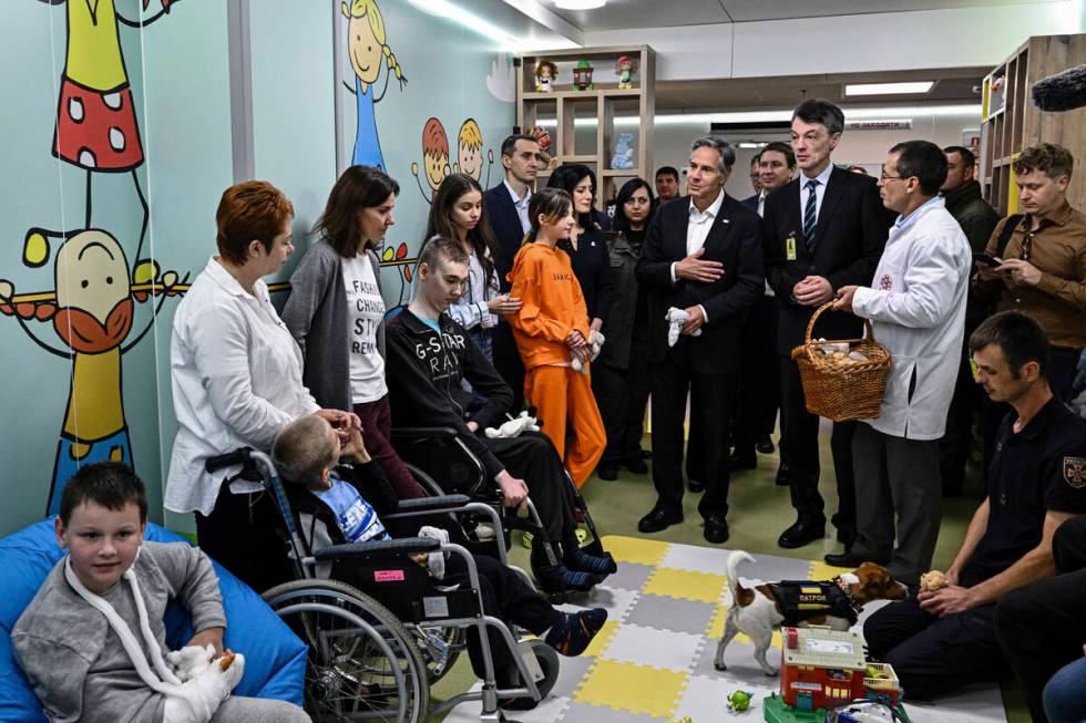 US Secretary of State Antony Blinken meets children during a visit to a children hospital in Ky ...