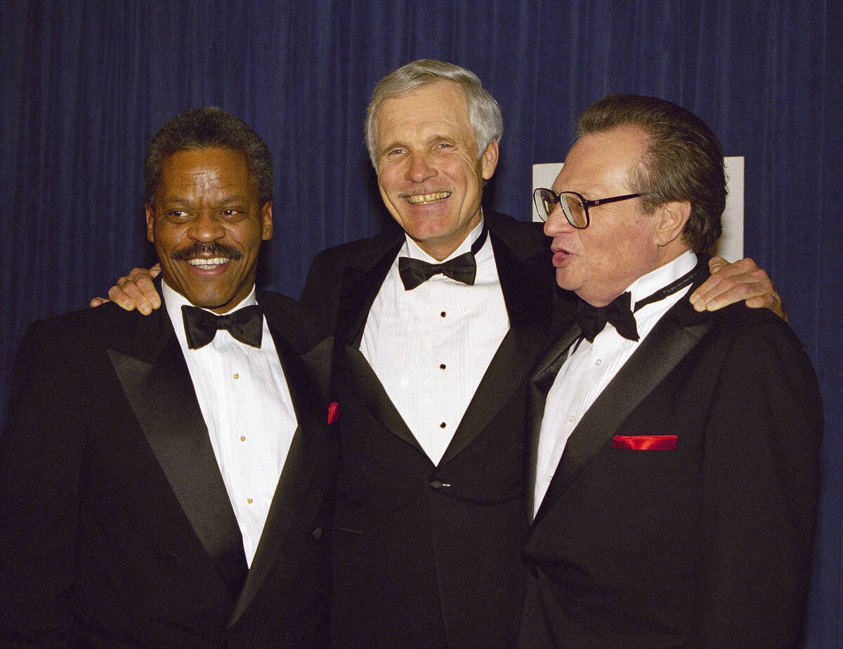 FILE - Ted Turner is joined by newsman Bernard Shaw, left, and Larry King, right, at a receptio ...