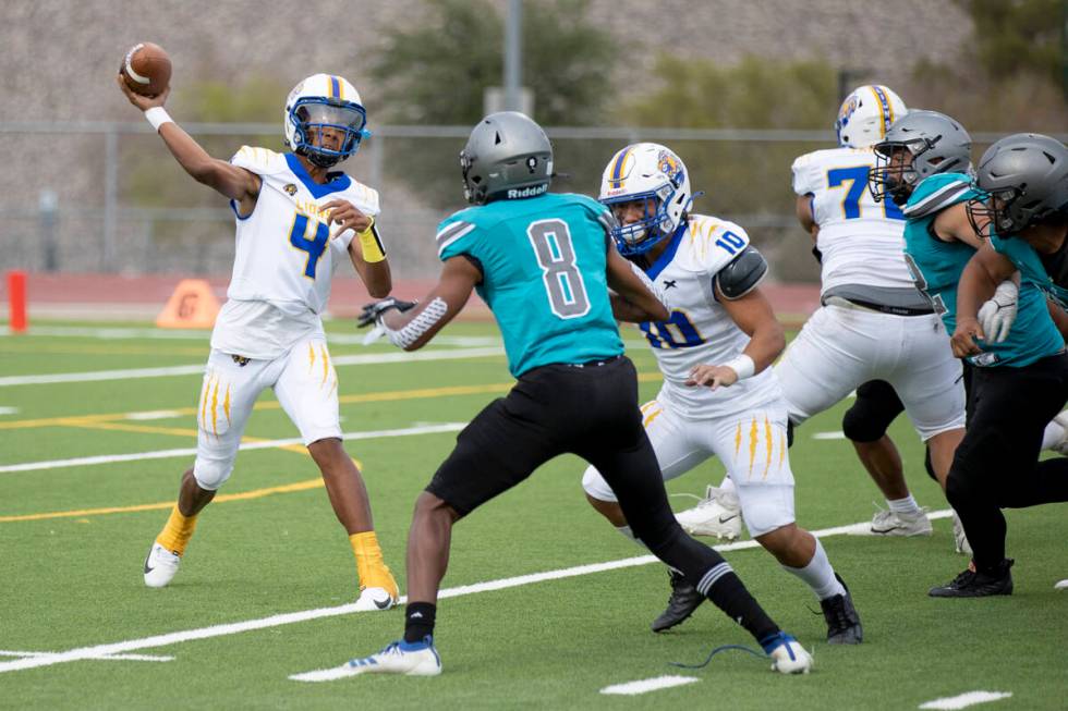 Sierra Vista junior Omari Evans (4) makes a pass against Silverado High School on Friday, Sept. ...