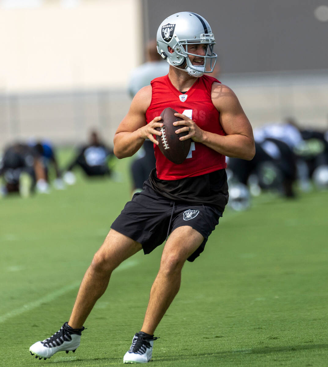 Raiders quarterback Derek Carr (4) drops back to pass during practice at the Intermountain Heal ...