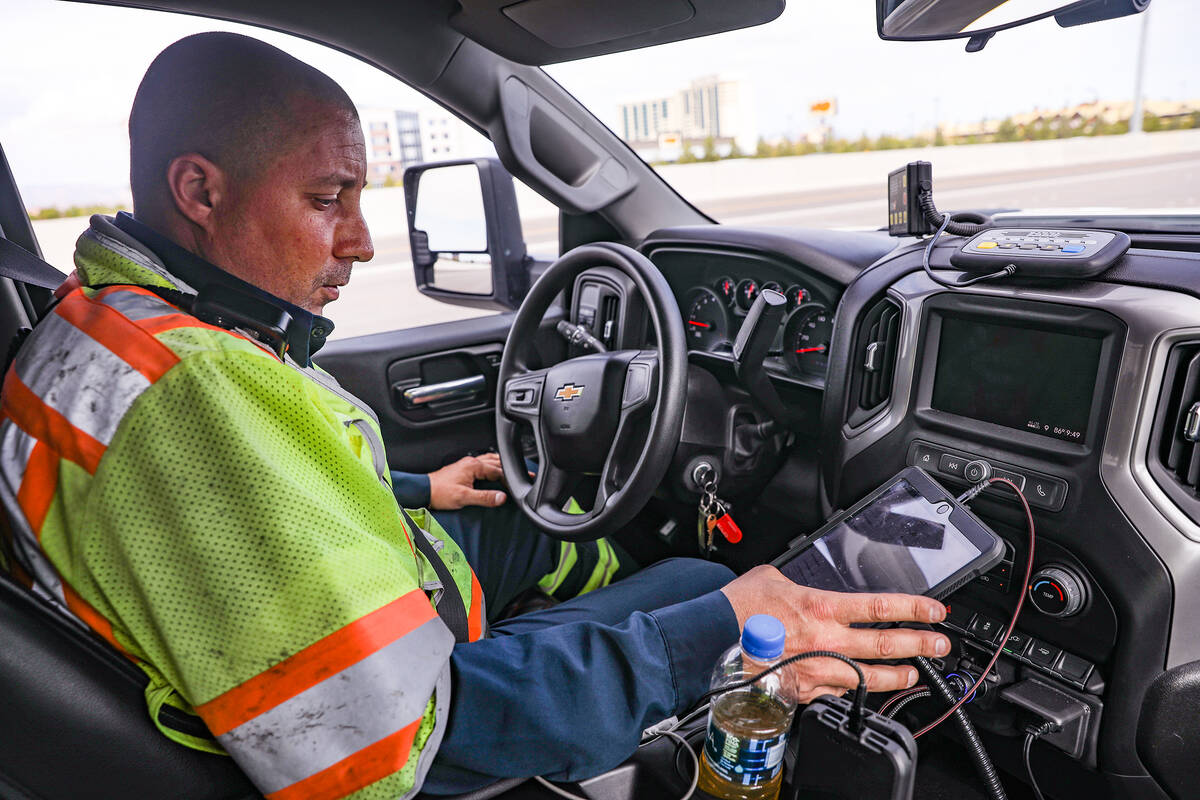 Stephen San Filippo, a supervisor Freeway Service Patrol operator, logs his work during his shi ...