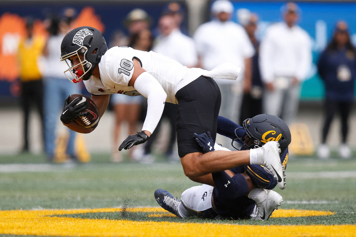UNLV Rebels wide receiver Nick Williams (10) is tackled by California Golden Bears safety Craig ...