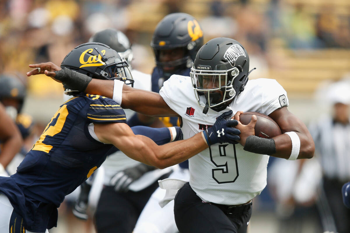 UNLV Rebels running back Aidan Robbins (9) is tackled by California Golden Bears safety Daniel ...