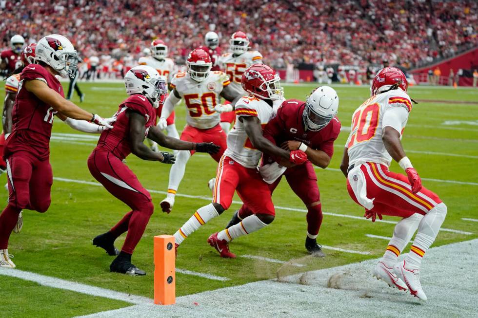 Kansas City Chiefs cornerback Rashad Fenton (27) stops Arizona Cardinals quarterback Kyler Murr ...