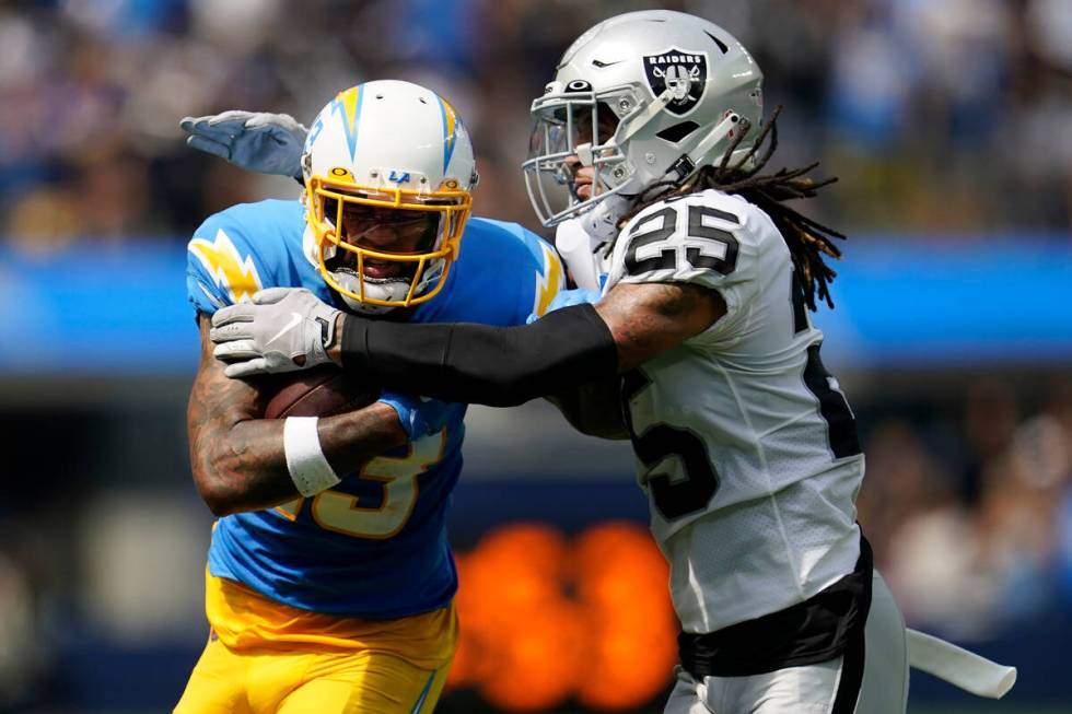 Los Angeles Chargers wide receiver Keenan Allen, left, runs after catching a pass against Las V ...