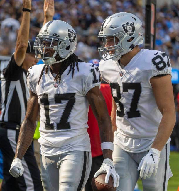 Raiders tight end Foster Moreau (87) celebrates wide receiver Davante Adams (17)’s touch ...