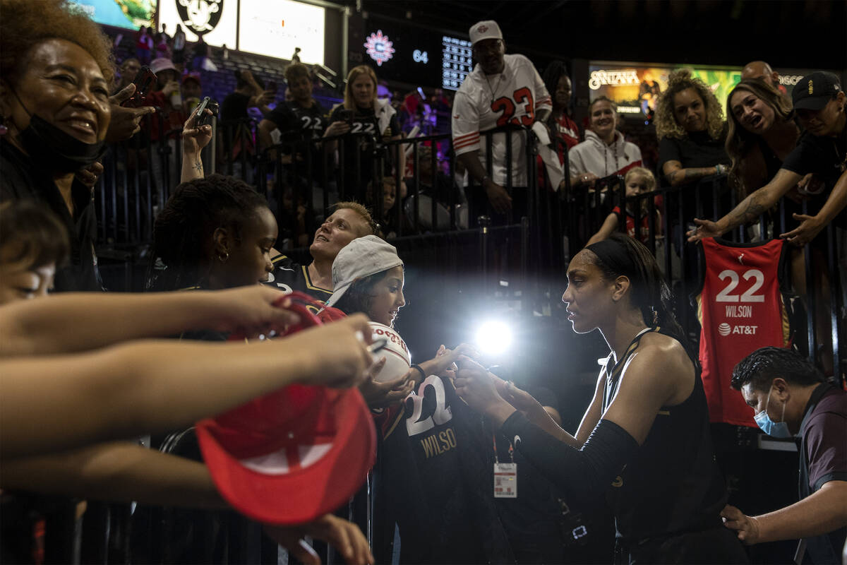 Las Vegas Aces forward A'ja Wilson (22) signs an autograph for a fan after winning Game 1 of a ...
