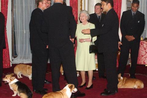 FILE - Britain's Queen Elizabeth II meets the New Zealand All Blacks rugby team will the royal ...