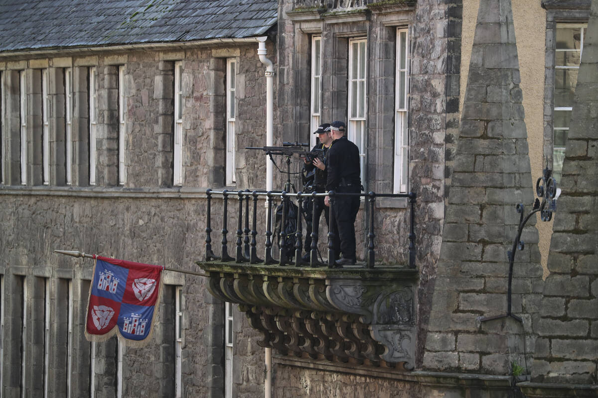 Police monitor the Royal Mile before the coffin of Queen Elizabeth II is transported to St Gile ...