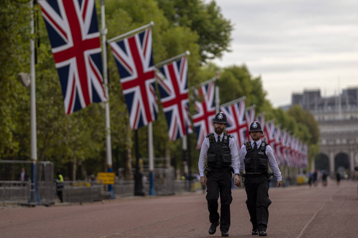 Police officers patrol near Buckingham Palace in London, Monday, Sept. 12, 2022. Queen Elizabet ...