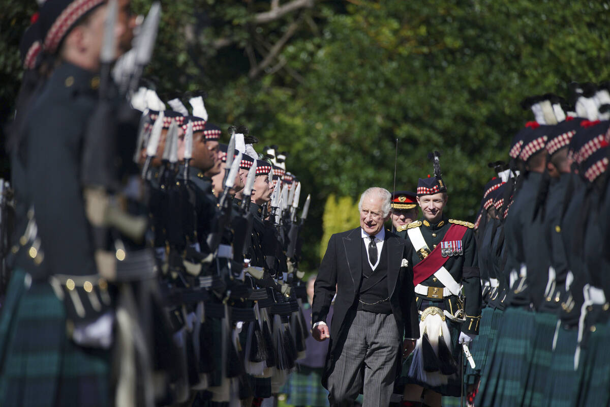 King Charles III inspects the Guard of Honour as he arrives to attend the Ceremony of the Keys, ...