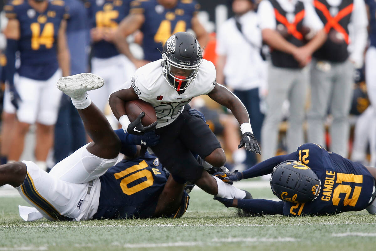 UNLV Rebels running back Courtney Reese (26) is tackled by California Golden Bears linebacker O ...