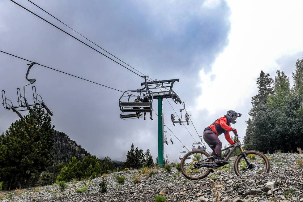 A bicyclist rides down a path at the downhill mountain bike park at Lee Canyon resort in Las Ve ...