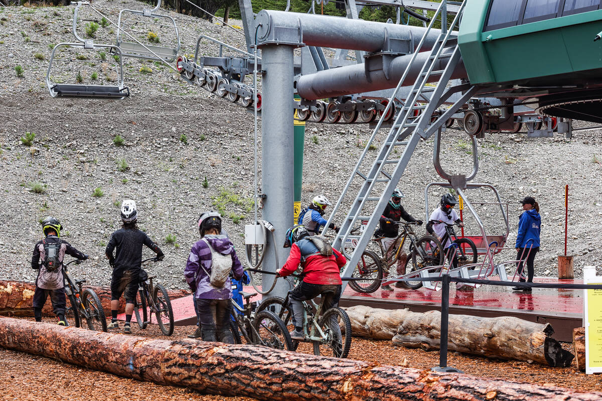 Bicyclists wait in line for the ski lift at the downhill mountain bike park at Lee Canyon resor ...