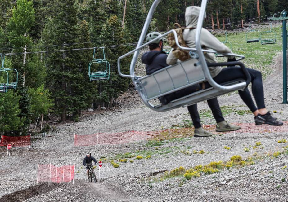 A bicyclist rides down a path at the downhill mountain bike park at Lee Canyon resort in Las Ve ...