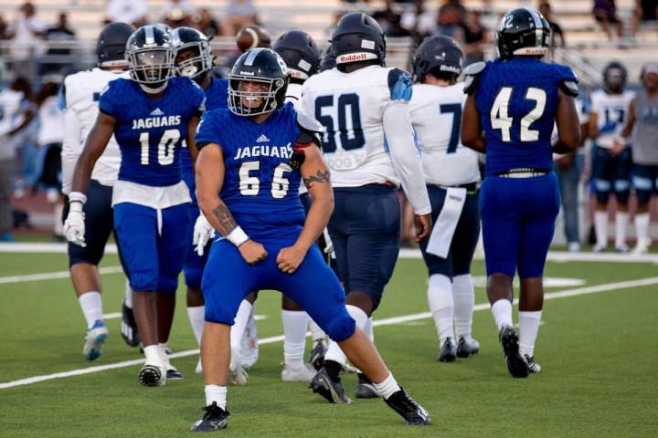 Desert Pines senior Michael Del Real (66) celebrates getting a sack during the first half of th ...