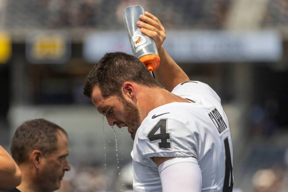 Raiders quarterback Derek Carr (4) cools off before an NFL game at SoFi Stadium against the Los ...