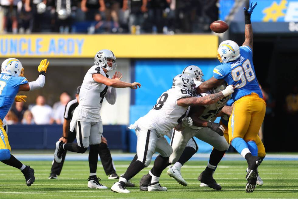 Raiders quarterback Derek Carr (4) throws the ball during the second half of a NFL football gam ...