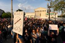 Demonstrators protest outside of the U.S. Supreme Court, May 3, 2022 in Washington, following n ...