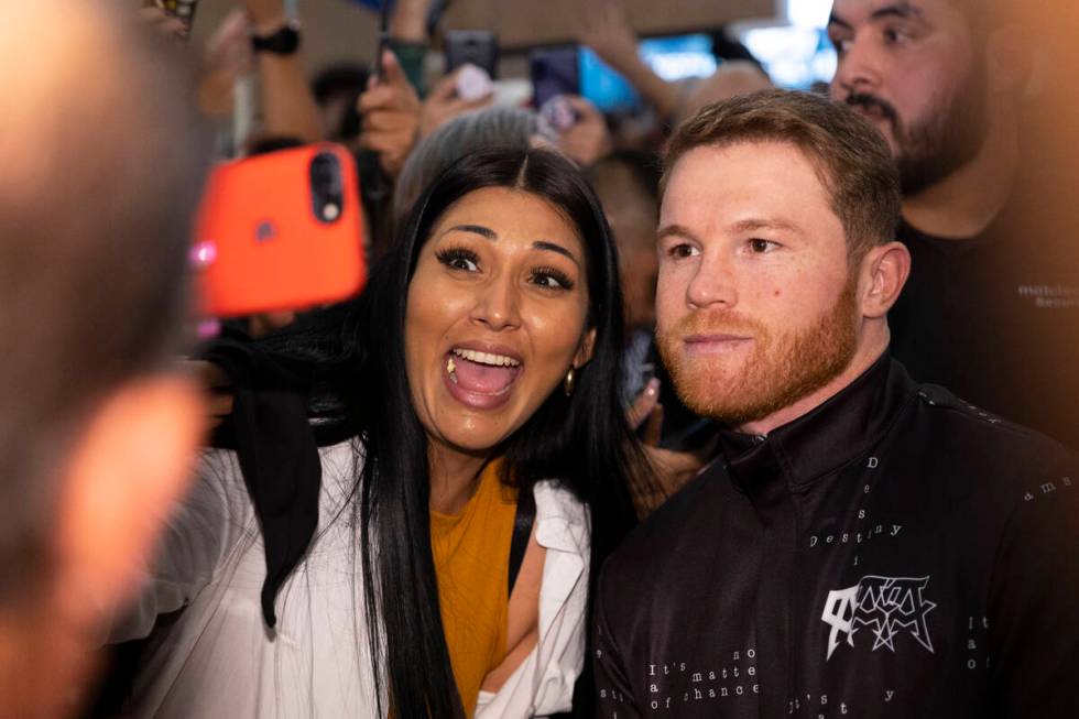 Saul "Canelo" Alvarez, right, poses for photos with fans during the "grand arriv ...
