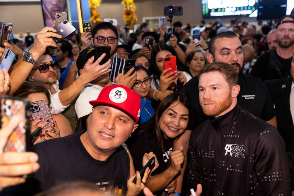 Saul "Canelo" Alvarez, right, poses for photos with fans during the "grand arriv ...
