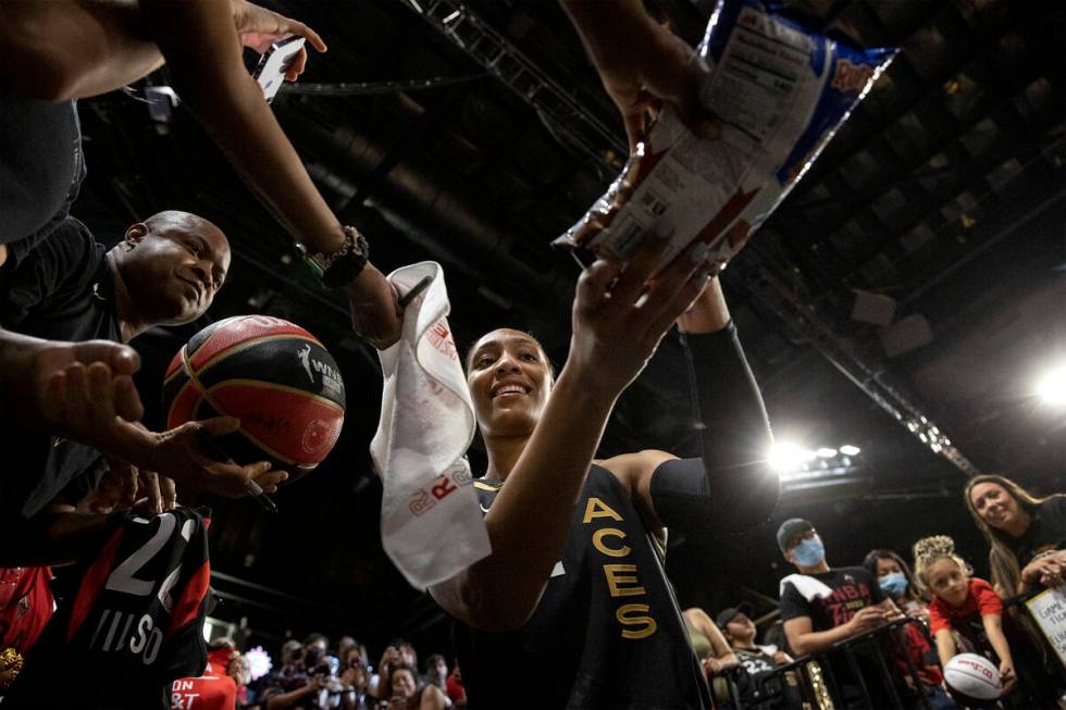 Las Vegas Aces forward A'ja Wilson (22) signs autographs for fans after winning Game 2 of a WNB ...