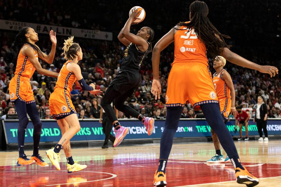 Las Vegas Aces guard Chelsea Gray (12) shoots against the Connecticut Sun during the second hal ...