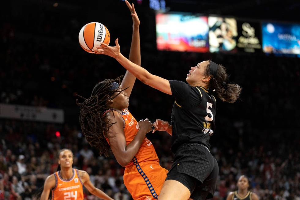 Las Vegas Aces forward Dearica Hamby (5) shoots against Connecticut Sun forward Jonquel Jones ( ...