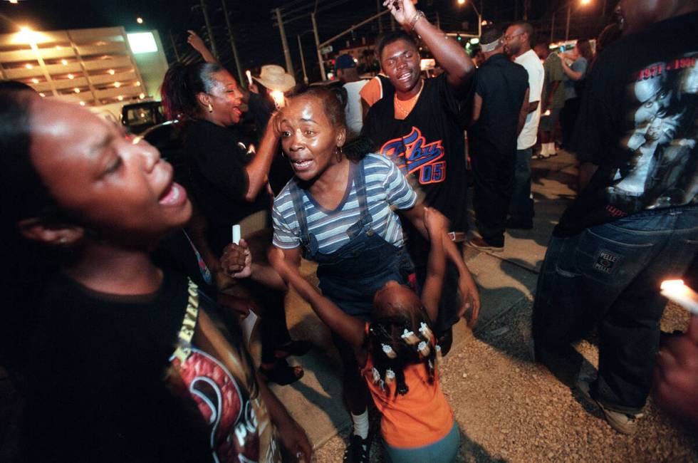 Fans dance during a candlelight vigil in 1998 on the second anniversary of the death of Tupac S ...