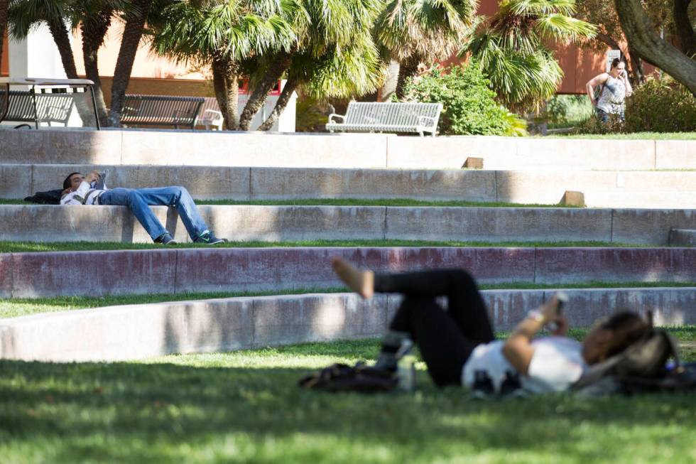 Two people rest on the grass at UNLV on Wednesday, April 20, 2016, in Las Vegas. Erik Verduzco/ ...