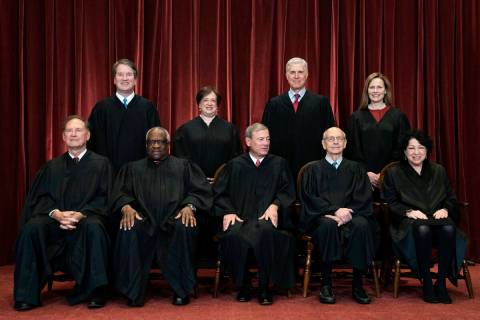 FILE - In this April 23, 2021, file photo, members of the Supreme Court pose for a group photo ...