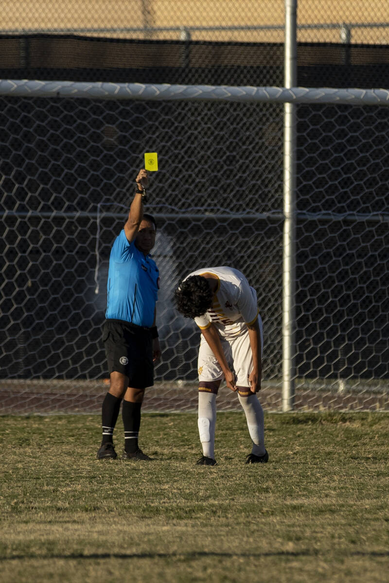 The referee shows Eldorado's Luis Martinez (15) a yellow card for a Chaparral penalty during El ...