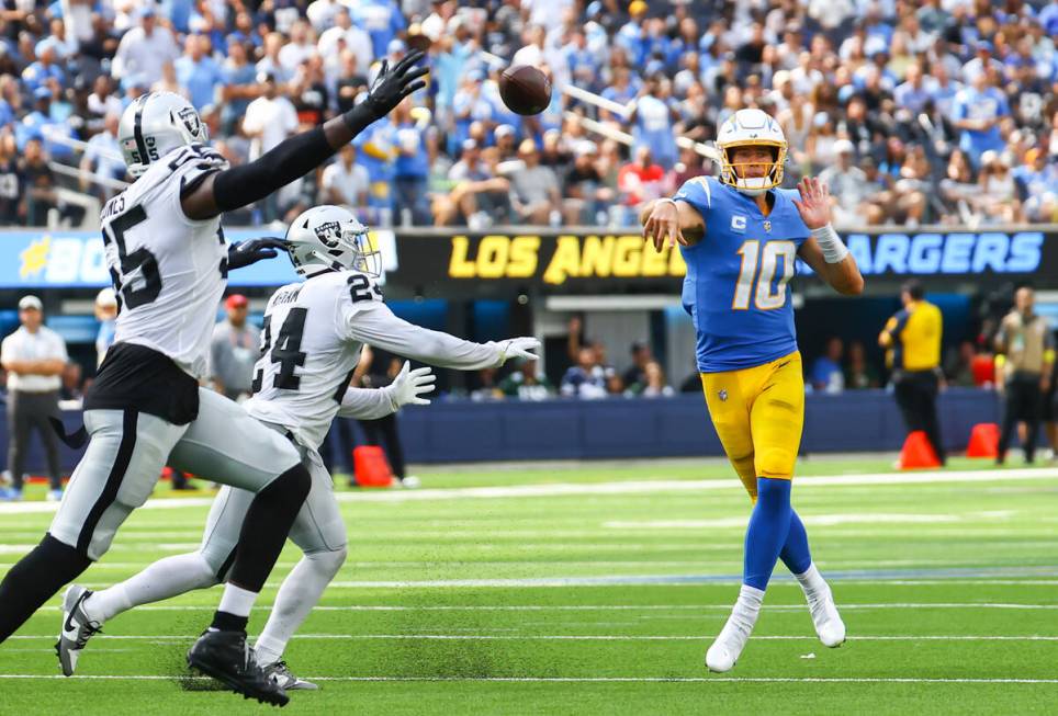 Los Angeles Chargers quarterback Justin Herbert (10) throws a pass against the Raiders during t ...