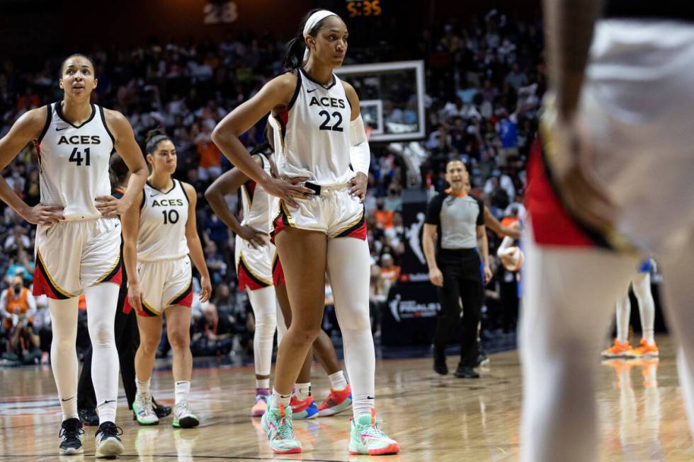 Las Vegas Aces starters center Kiah Stokes (41), guard Kelsey Plum (10) and forward A'ja Wilson ...