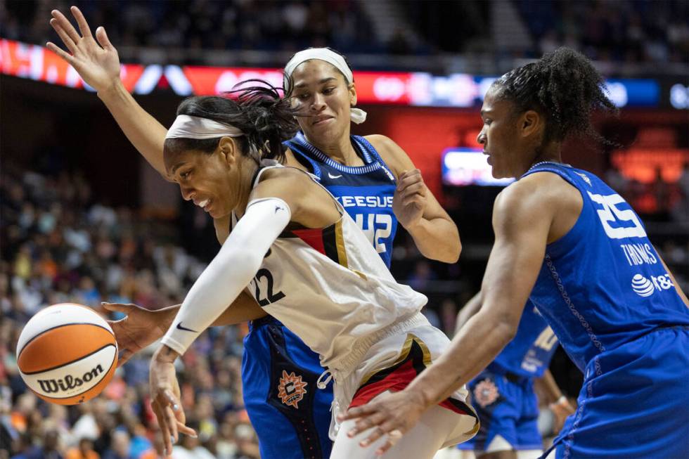 Las Vegas Aces forward A'ja Wilson (22) struggles to shoot against Connecticut Sun center Brion ...