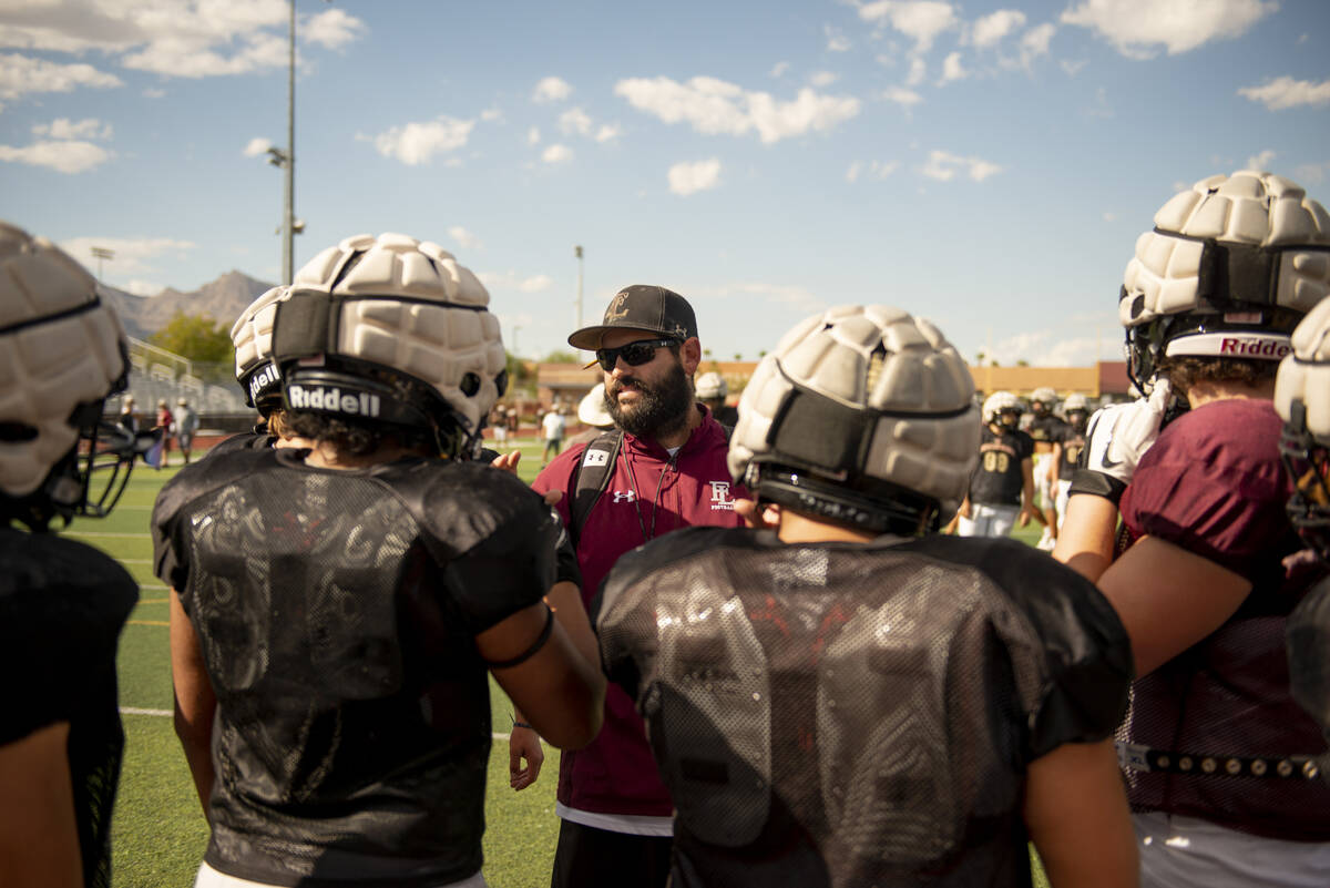 Assistant coach Jay Staggs talks to players during practice at Faith Lutheran High School on We ...