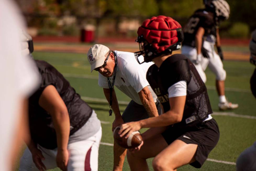 Former UNLV coach, and Faith Lutheran head coach, Mike Sanford leads a drill during practice at ...