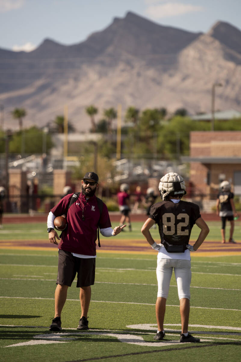 Assistant coach Jay Staggs leads a drill during practice at Faith Lutheran High School on Wedne ...
