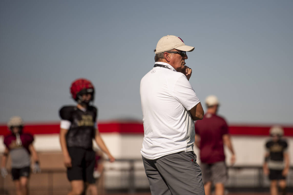 Former UNLV coach, and Faith Lutheran head coach, Mike Sanford leads a drill during practice at ...