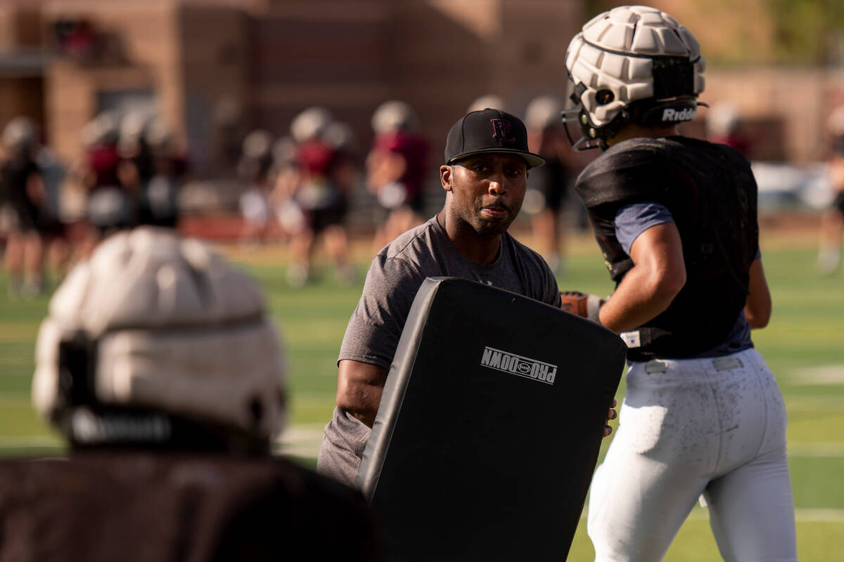 Assistant coach Dominique Dorsey leads a drill during practice at Faith Lutheran High School on ...