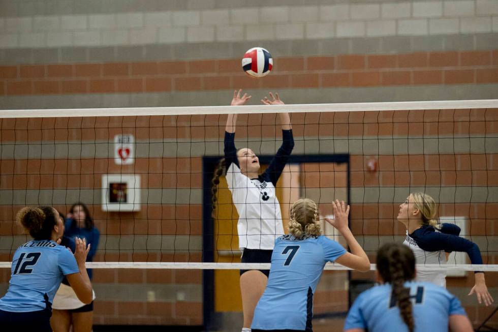 Shadow Ridge's Joli Salazar (8) sets the ball for Lexi Luszeck (9) during their match against F ...